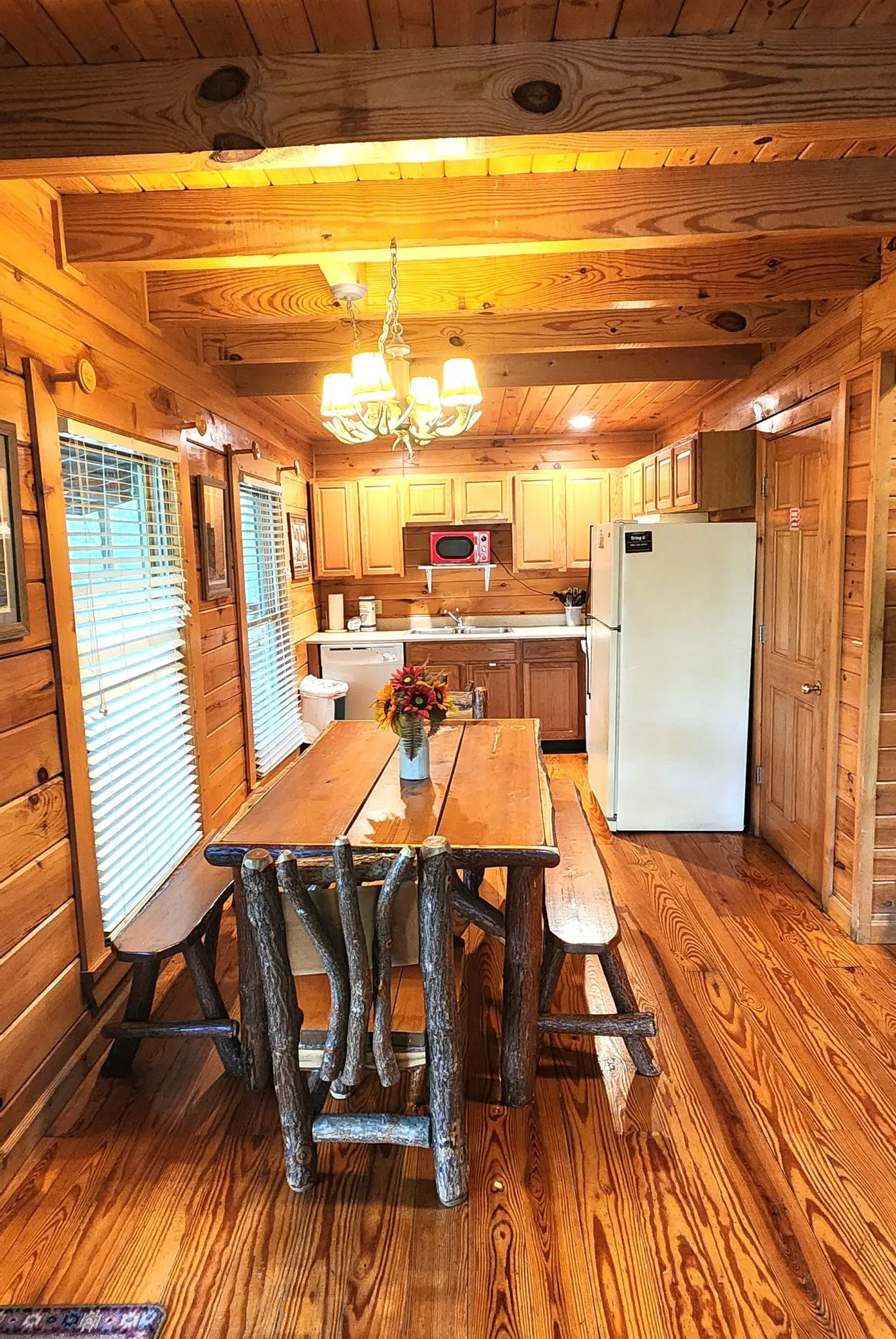 Fully equipped kitchen and rustic dining table at Heavenly Heights